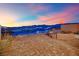 Brick patio with fire pit, scenic city views and comfortable seating perfect for outdoor relaxation at 658 Falcon Summit Ct, Henderson, NV 89012