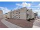 Beige multi-Gathering home, with simple landscaping around the building at 6800 E Lake Mead Blvd # 1033, Las Vegas, NV 89156