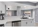 Contemporary kitchen featuring stainless steel dishwasher and modern faucet fixtures at 6800 E Lake Mead Blvd # 1033, Las Vegas, NV 89156