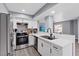 Modern kitchen with stainless steel appliances, white cabinets, and ample counter space at 6800 E Lake Mead Blvd # 1033, Las Vegas, NV 89156