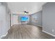 Spacious living room features wood-look floors, ceiling fan and large window at 6800 E Lake Mead Blvd # 1033, Las Vegas, NV 89156