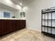 Bathroom featuring double sinks with dark wood cabinets and tile floors at 727 Pickled Pepper Pl, Henderson, NV 89011