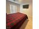 Bedroom with a comfortable bed, access to a balcony, and natural light at 727 Pickled Pepper Pl, Henderson, NV 89011