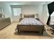 Comfortable bedroom featuring neutral carpeting, a window for natural light, and ample space at 727 Pickled Pepper Pl, Henderson, NV 89011