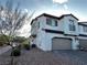 Beautiful two-story home featuring a two-car garage and well-maintained landscaping at 727 Pickled Pepper Pl, Henderson, NV 89011