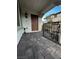 Charming tiled front porch with black metal railings and front door, offering a welcoming entry to the home at 727 Pickled Pepper Pl, Henderson, NV 89011