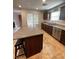Well lit kitchen featuring stainless steel appliances, granite countertops and light tile flooring at 727 Pickled Pepper Pl, Henderson, NV 89011