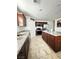 Functional kitchen featuring stainless steel appliances, granite counters, and tile flooring at 727 Pickled Pepper Pl, Henderson, NV 89011
