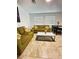 Comfortable living room with neutral walls, tile floors, and large windows at 727 Pickled Pepper Pl, Henderson, NV 89011