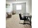 Versatile room featuring two decorative chairs and a work desk bathed in natural light at 727 Pickled Pepper Pl, Henderson, NV 89011