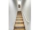 Carpeted stairway leading to upper level with white handrail and neutral walls at 727 Pickled Pepper Pl, Henderson, NV 89011