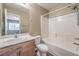 This bathroom offers a tub, toilet, and wood-finished vanity with ample space at 7270 Sheared Cliff Ln # 104, Las Vegas, NV 89149