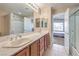 Bathroom featuring double sinks, and separate shower and toilet areas at 7270 Sheared Cliff Ln # 104, Las Vegas, NV 89149