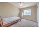 This bedroom has carpet, a full bed, and a large window for natural light at 7270 Sheared Cliff Ln # 104, Las Vegas, NV 89149
