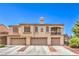 Inviting multi-Gathering home featuring a red tile roof and three individual garages for convenient parking at 7270 Sheared Cliff Ln # 104, Las Vegas, NV 89149