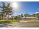 Stately home featuring lush landscaping, mature trees, and a circular driveway at 7270 Sheared Cliff Ln # 104, Las Vegas, NV 89149