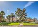 Expansive home with a lush green lawn, mature trees, and a welcoming entrance at 7270 Sheared Cliff Ln # 104, Las Vegas, NV 89149