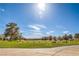 Scenic golf course view with manicured greens, trees, and mountain views in the distance at 7270 Sheared Cliff Ln # 104, Las Vegas, NV 89149
