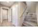 Inviting hallway with stairs, leading to additional living space, and access to laundry area at 7270 Sheared Cliff Ln # 104, Las Vegas, NV 89149