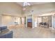 Expansive living area with tiled floors, seamless flow to the dining area and natural light at 7270 Sheared Cliff Ln # 104, Las Vegas, NV 89149
