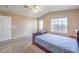 Main bedroom featuring vaulted ceilings, two windows and neutral walls and carpet at 7270 Sheared Cliff Ln # 104, Las Vegas, NV 89149