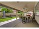 Beautiful backyard with lush green lawn, manicured landscaping, and a covered patio perfect for outdoor entertaining at 7613 Hackensack Ct, Las Vegas, NV 89128
