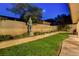 Well-maintained backyard featuring a manicured lawn and elegant garden statue at 7613 Hackensack Ct, Las Vegas, NV 89128