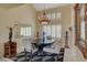 Elegant dining area featuring a chandelier, modern decor, and large window shutters at 7613 Hackensack Ct, Las Vegas, NV 89128