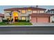 Inviting two-story home with warm lighting and a spacious two-car garage at 7613 Hackensack Ct, Las Vegas, NV 89128