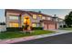 Charming two-story home featuring a terra cotta tile roof, manicured lawn, and a two-car garage at 7613 Hackensack Ct, Las Vegas, NV 89128