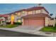 Lovely two-story home with a well-maintained lawn and a convenient two-car garage at 7613 Hackensack Ct, Las Vegas, NV 89128