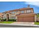 Charming two-story home featuring a tiled roof, stucco exterior, and attached two-car garage at 7613 Hackensack Ct, Las Vegas, NV 89128