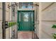 Inviting front entrance with decorative ironwork and lush landscaping at 7613 Hackensack Ct, Las Vegas, NV 89128