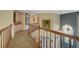 Upstairs hallway with unique carpet, custom cabinetry, and elegant decor at 7613 Hackensack Ct, Las Vegas, NV 89128