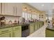 Bright kitchen features stainless steel appliances, granite countertops, and window shutters at 7613 Hackensack Ct, Las Vegas, NV 89128