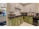 Kitchen featuring granite countertops, stainless steel appliances, and white upper cabinets at 7613 Hackensack Ct, Las Vegas, NV 89128