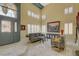 Spacious living room with marble floors, high ceilings, and elegant, neutral-toned furniture at 7613 Hackensack Ct, Las Vegas, NV 89128