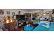 Cozy living room displaying an array of decorations, a large screen TV, and comfortable seating arrangement at 7885 W Flamingo Rd # 1127, Las Vegas, NV 89147