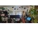 Comfortable living area showcasing festive decor, workspace setup, and ample natural light from the window at 7885 W Flamingo Rd # 1127, Las Vegas, NV 89147