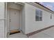 Welcoming front entrance with a neutral-colored door and a 'Welcome' mat at 8121 Heavenly Star Cir, Las Vegas, NV 89128