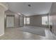 Inviting living room with tile floors, neutral walls, a fireplace, and bright windows at 8121 Heavenly Star Cir, Las Vegas, NV 89128