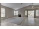 Bright living area with a fireplace, tile flooring, and sliding doors to the backyard at 8121 Heavenly Star Cir, Las Vegas, NV 89128
