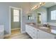 Bathroom featuring a double vanity, granite counters, and views to a second bathroom at 8232 Sedona Sunset Dr, Las Vegas, NV 89128