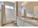 Bathroom featuring a double vanity, granite counters, and shower-tub combo at 8232 Sedona Sunset Dr, Las Vegas, NV 89128