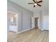 Bedroom featuring wood floor and a door to the bathroom at 8232 Sedona Sunset Dr, Las Vegas, NV 89128