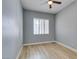 Bedroom with wood floor, neutral paint, ceiling fan, and shuttered window at 8232 Sedona Sunset Dr, Las Vegas, NV 89128
