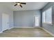 Bedroom featuring wood floor, neutral paint, and a door to the outside at 8232 Sedona Sunset Dr, Las Vegas, NV 89128