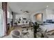 Open concept dining area flows into kitchen and living room with fireplace at 8232 Sedona Sunset Dr, Las Vegas, NV 89128