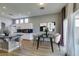 Open concept dining area and breakfast bar with black countertops at 8232 Sedona Sunset Dr, Las Vegas, NV 89128