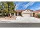 Charming single-story home with a well-manicured yard and a two-car garage at 8232 Sedona Sunset Dr, Las Vegas, NV 89128